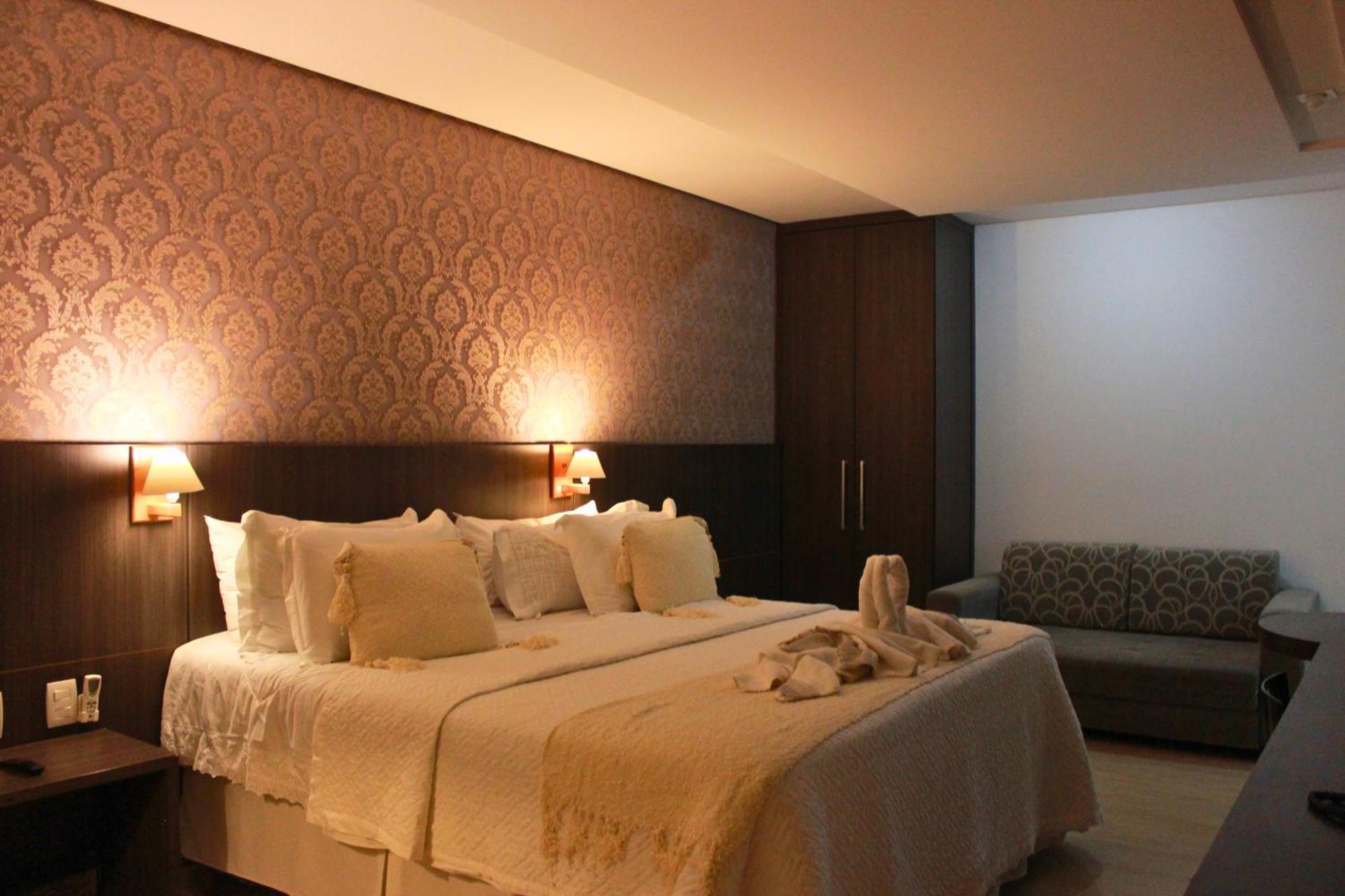 Gontijo Inn Hotel Itajubá Εξωτερικό φωτογραφία A bedroom in a hotel